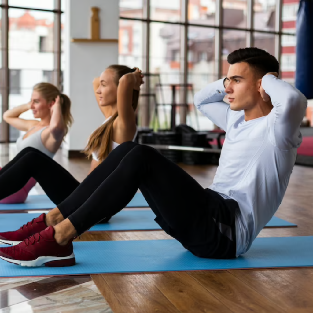 Adults practising together on mats in a bright studio
